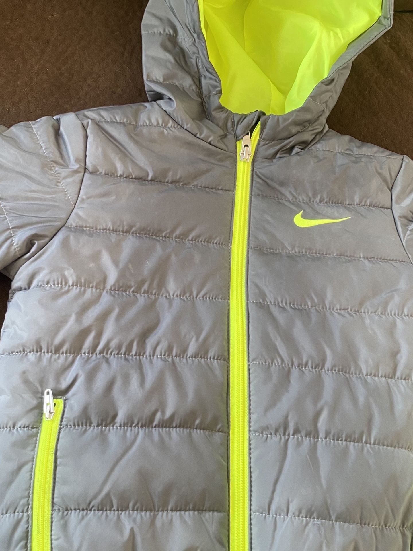 two new jackets and the green Nike once used is almost new I only ask 10 dollars each for children from 1 to 5 years