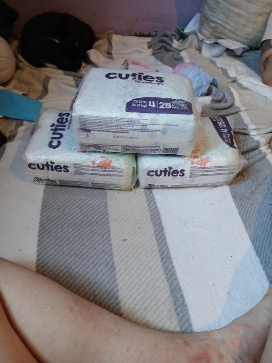cuties diapers size 4 . 3 packs