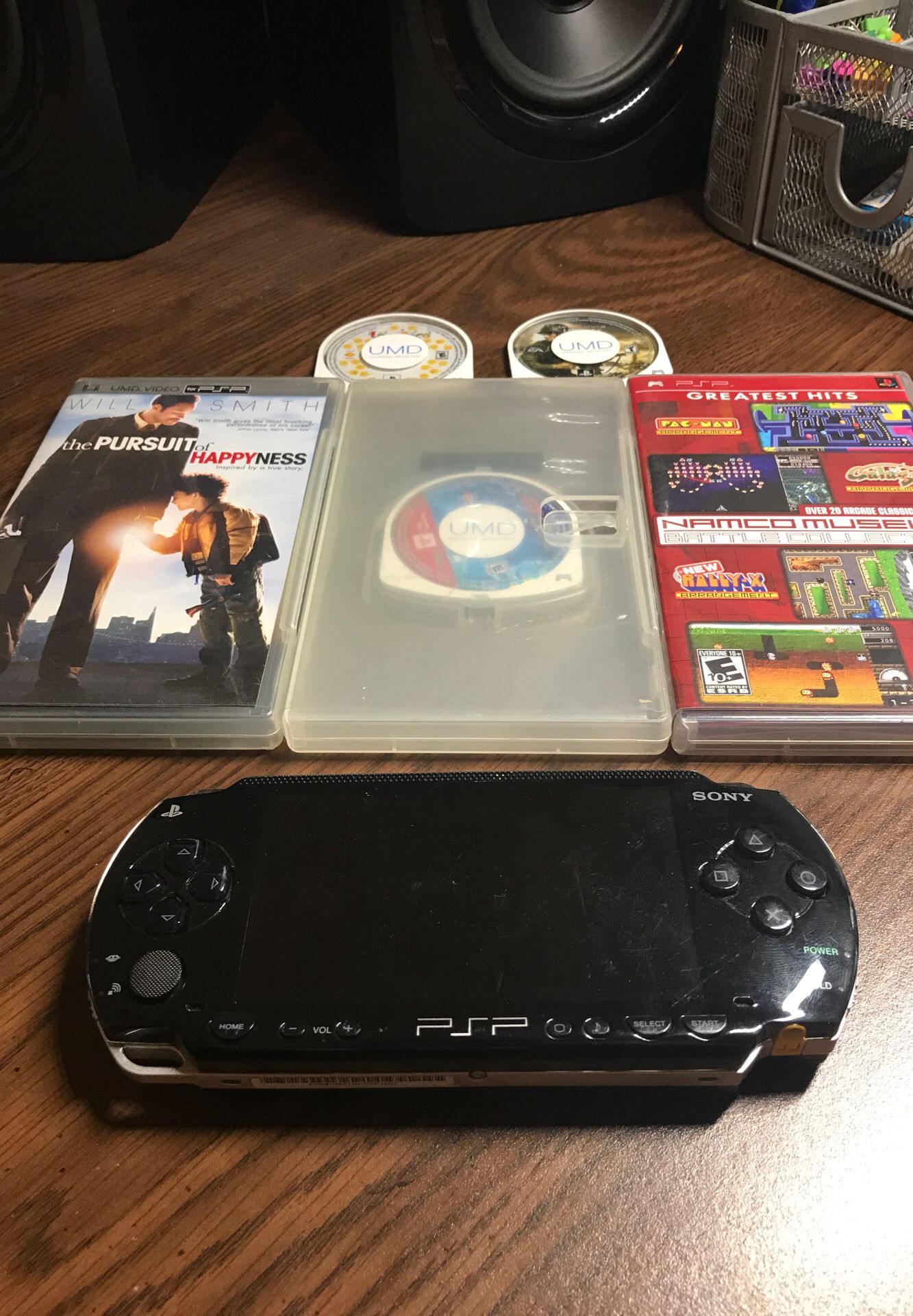 Used PSP + 4 games + 1 movie NO BATTERY/CHARGER