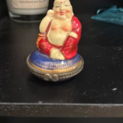 Vintage Porcelain Hinged Box Buddha sitting on Blue Pillow