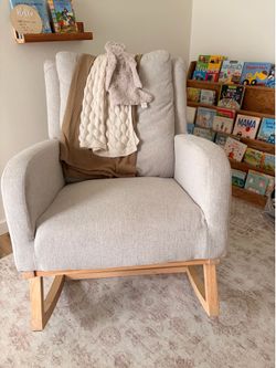 Oatmeal colored upholstered rocking chair