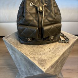 Authentic Chanel Quilted Drawstring Bucket Bag with CC Pockets – Used, Good Condition