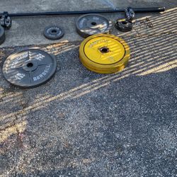 Barbell 2 In. Olympic Bar 84in. And Weight Plates 