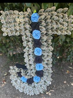 Initial shaped flower arrangement