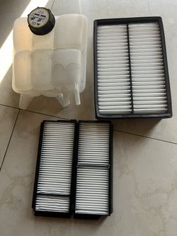 2004 Mazda 3. Coolant Reservoir With Cap. Air Filter/ Cabin Filter