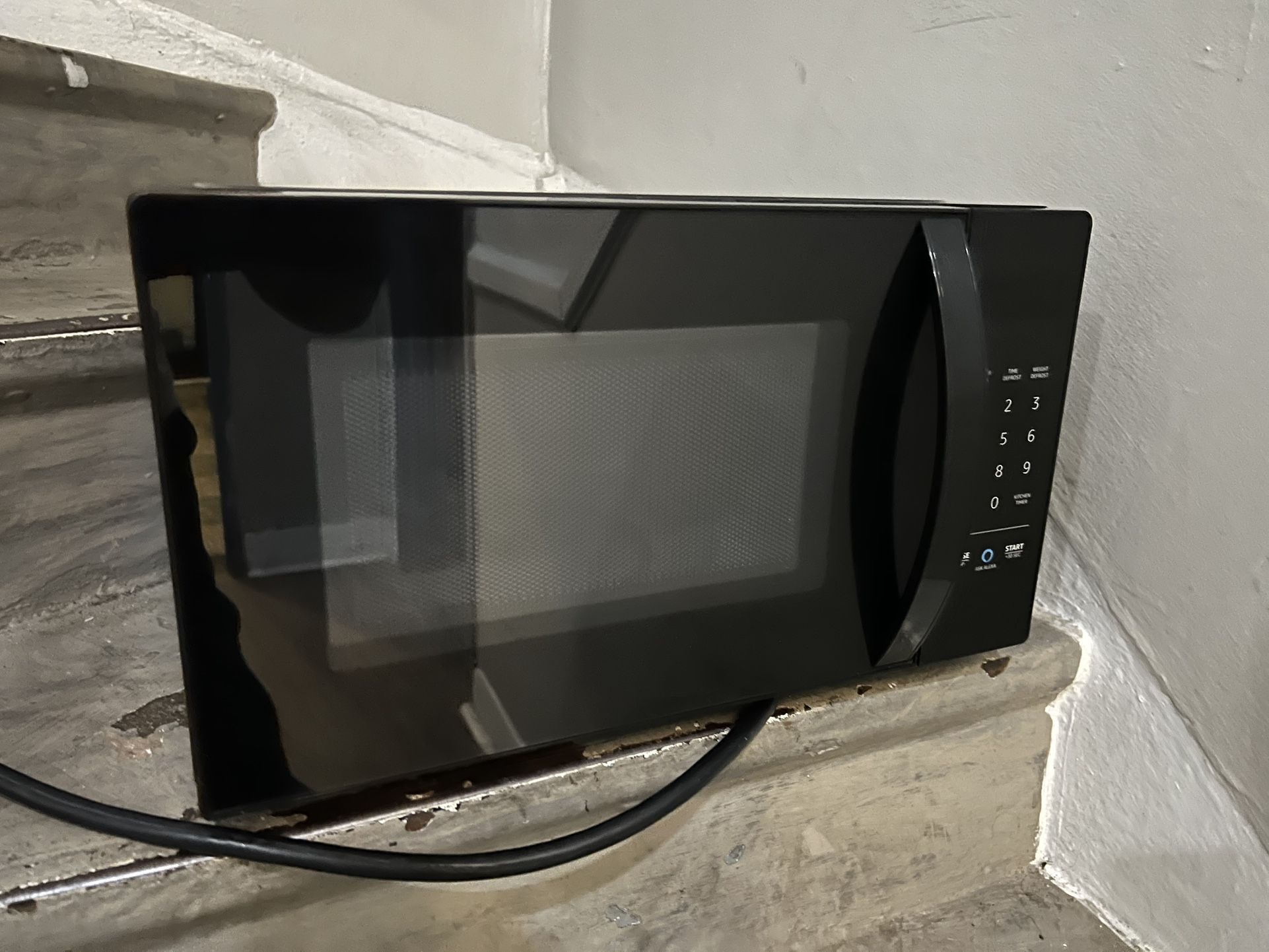 echo dot + AmazonBasics Microwave Oven