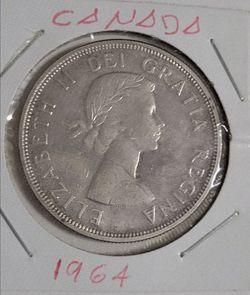 1964 Canadian Charlottetown-Quebec Commemorative Silver Dollar.