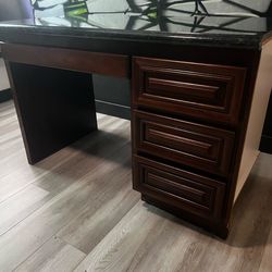 Wood office desk with granite top.