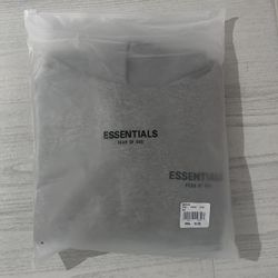 Grey Essentials Fear of God hoodie with black lettering