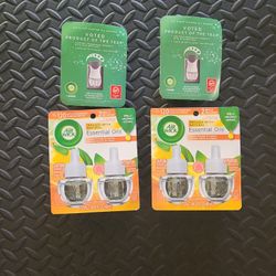 Air Wick = 2 Plug-in Oil Warmer & 4 Scented Essential Oils Refills