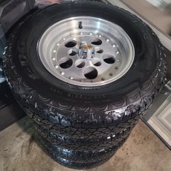CHEVY OBS RIMS AND TIRES 235/75/15 KELLY EDGE AT TIRES 5 LUGS   In great condition to be over 36 years old all aluminum wheels..