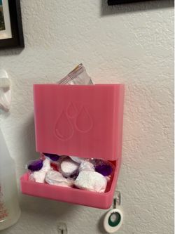 Dishwasher pod dispenser