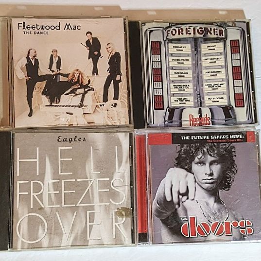 Four CDs Group Lot Fleetwood Mac Foreigner Eagles The Doors See More Info Below 