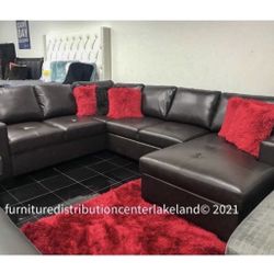 Brown Leather Sectional With Storage And Sleeper