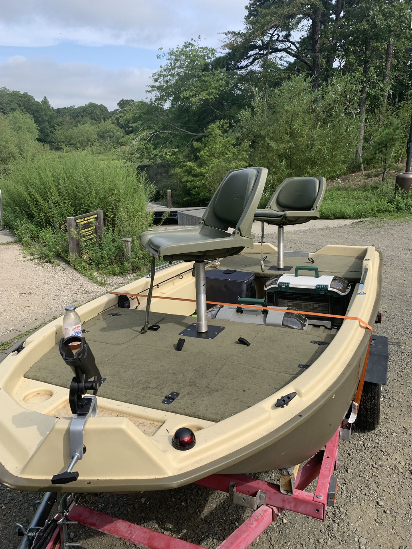 Sun Dolphin pro 120 bass boat. Includes 62 pound thrust motor trailer and battery
