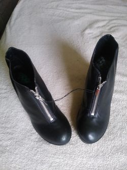 Black zipper front shory boots.