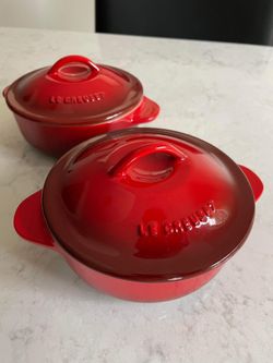 A Set Of Two Small Red Le Crueset Casserole Dish With Lid
