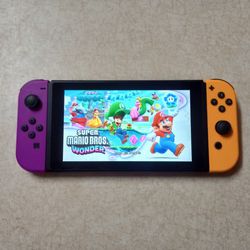 NINTENDO SWITCH with Over 100 GAMES INSTALLED MARIO PARTY,POKEMON,ZELDA,MARIO KART,MINECRAFT  and Many More