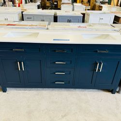 Brand new bathroom vanity in Navy Blue “72" double sink, soft close and solid wood. 6 Drawers, 4 doors with electrical outlets and Marble top in white