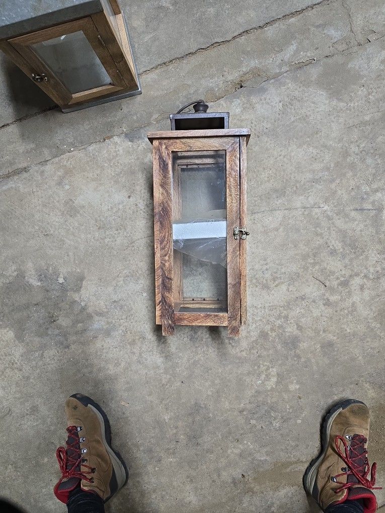 Wooden outdoor decorative lantern with
metal top