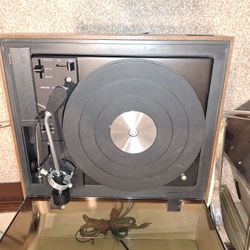 The Fisher" Model 30 Philharmonic FM/AM Stereo with a BSR Synchronous turntable. 
