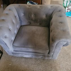 Gray, swayed chair 