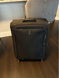 black travel pro checked luggage