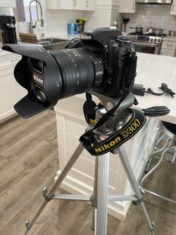 Nikon D300 Digital Camera with DX lense (AF-S NIKKOR 18-200mm), with adjustable Tripod, Battery and Charger, In Excellent Condition and Works Perfect.