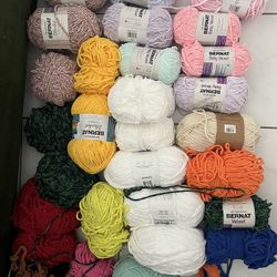 28 bundles of yarn and crochet hooks 