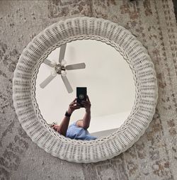 Vintage 24" white wicker and rattan round mirror