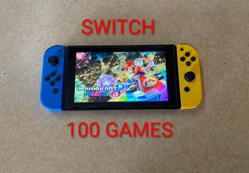 NINTENDO SWITCH + 125 SWITCH GAMES INCLUDED