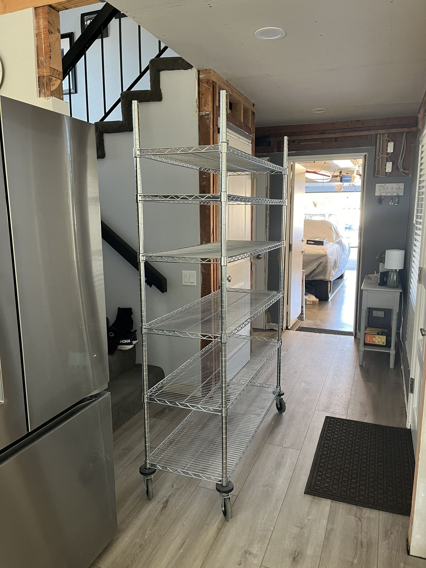 Metal wire shelving unit on wheels