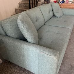 Green sofa used, normal wear