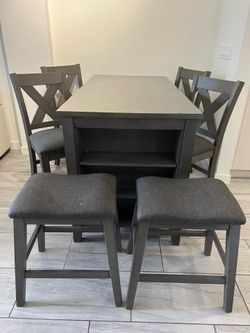 Grey wood high top dining set with four chairs and two stools