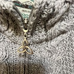 Aran Crafts 100% Merino Wool cable-knit cardigan with a Celtic knot zipper pull