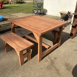 Handcrafted wooden table and benches