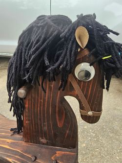 Brown wooden horse rocker antique