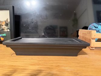 Black plastic shelf