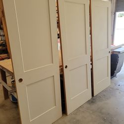 One bathroom door and two bedroom doors