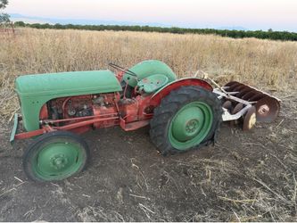 Messi Ferguson tractor with 4 attachments. 2 tires, 1 extra rim. 2 inner tubes