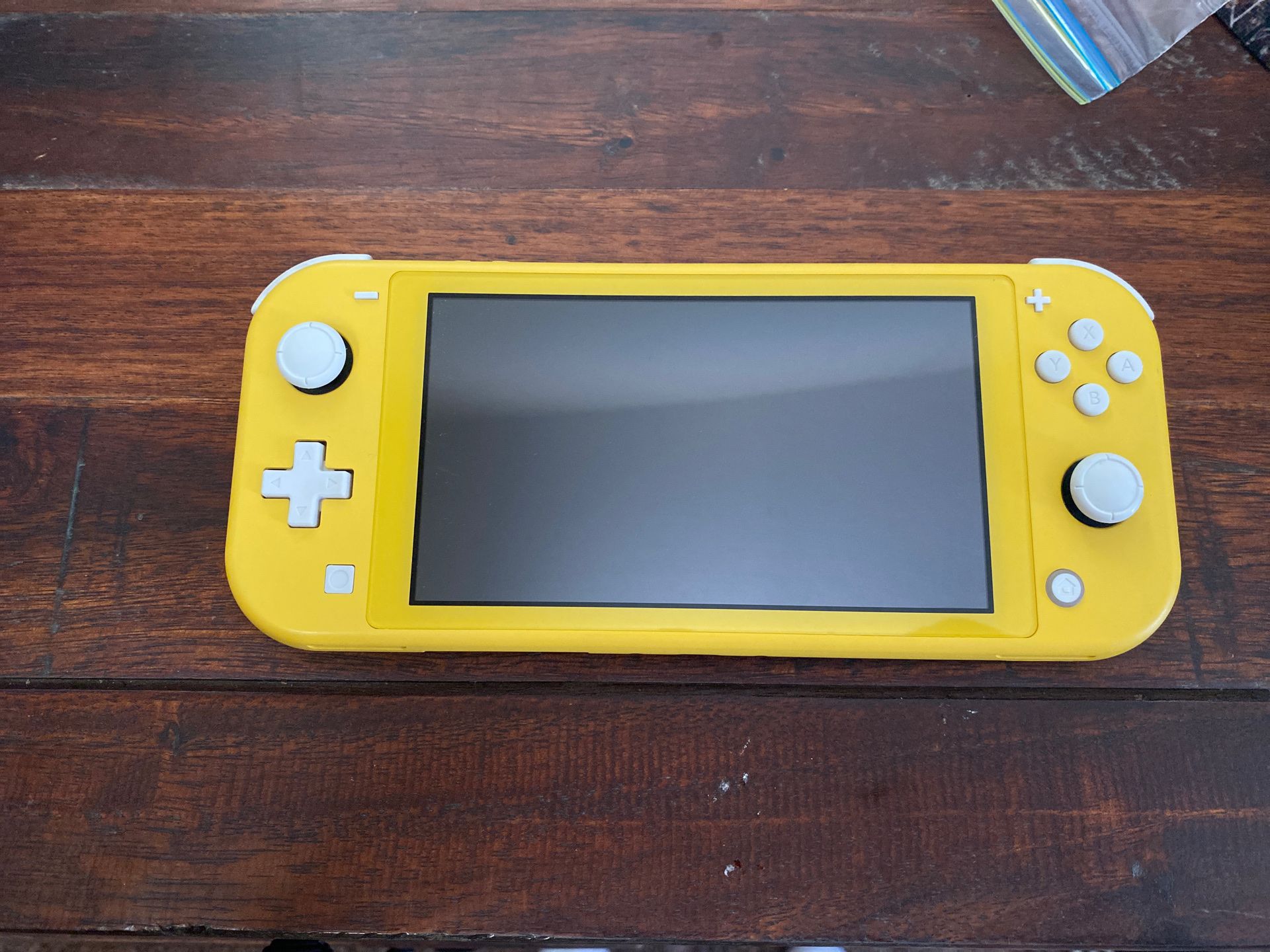 NITENDO SWITCH LITE : NEW/ ONLY USED A FEW TIMES/ POKÉMON GAME AND CHARGER INCLUDES/ SANITIZED AND READY FOR USE