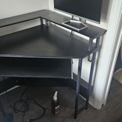 Cornered Desk With Plugs In Desk