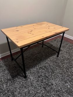 Wooden table with metal legs