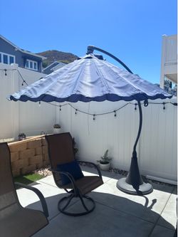 Umbrella with weighted stand