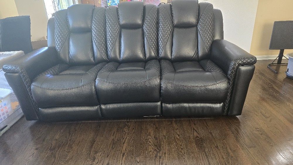Black Three Seater Faux Leather Reclining Sofa