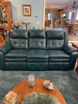 Beautiful Green Leather Reclining Sofa. $1500
