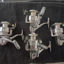 (4) SHIMANO TX 4000 FB SPINNING REELS. 