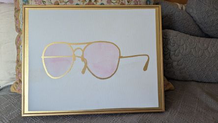Pink & gold sunglasses on canvas