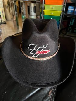 black felt-style cowboy hat featuring a distinctive metal and embroidered MotoGP logo