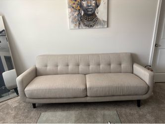Tan sofa from AT HOME